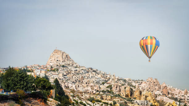 istock Uchisar Town and Balloon view, Cappadocia 1946378180