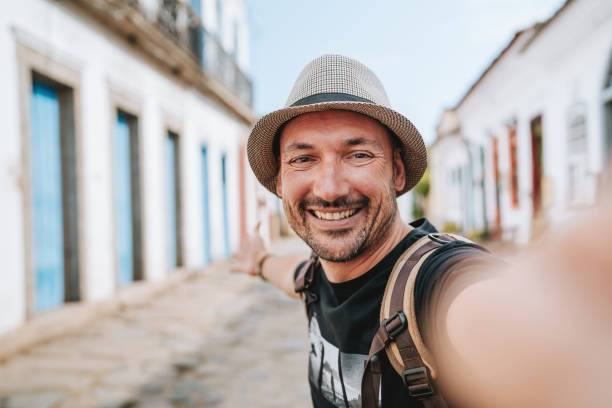 istock Man taking selfie in tourist city 1946382411