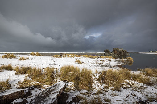 Turtle rock beach covered in snow after a rare winter storm brought snow to the Southern Oregon coast late February 2023