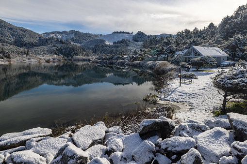 beautiful tranquil scene in gold beach with hunter creek and snow, a rare weather event that happened February 24, 2023.