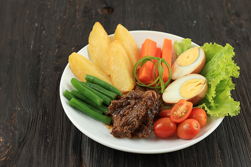 Selat Solo, Braised Beef Steak in Sweet Soy Sauce with Eggs, Potato, and Carrot. Javanese Dish Known as Bistik Jawa, Dutch Influenced