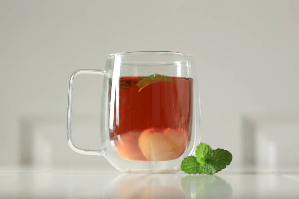 Lychee Iced Tea on Double Wall Glass with Mint Leaves