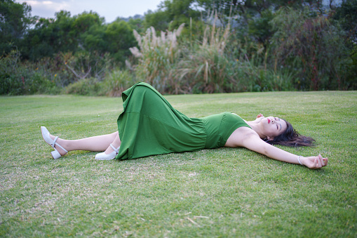 Beautiful woman lying on the grass