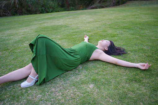 woman lying on the grass