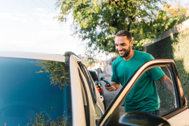 istock Man getting into the car to drive 1946482447