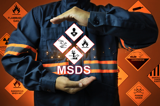 MSDS chemical material safety data sheet concept with staff show warning signs of hazardous substances data to indicate emergency situation preparation for prevent potential dangerous