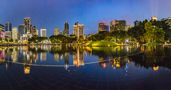 Lake in the evening, near by Twin Towers with city on background. Kuala Lumpur, Malaysia.