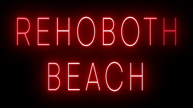 Glowing and blinking red retro neon sign for REHOBOTH BEACH