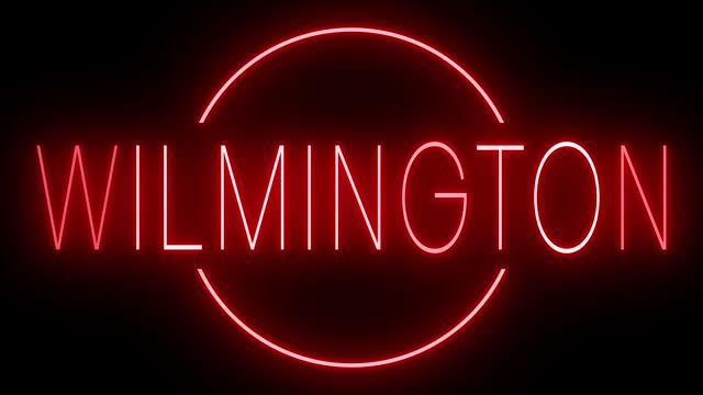 Glowing and blinking red retro neon sign for WILMINGTON