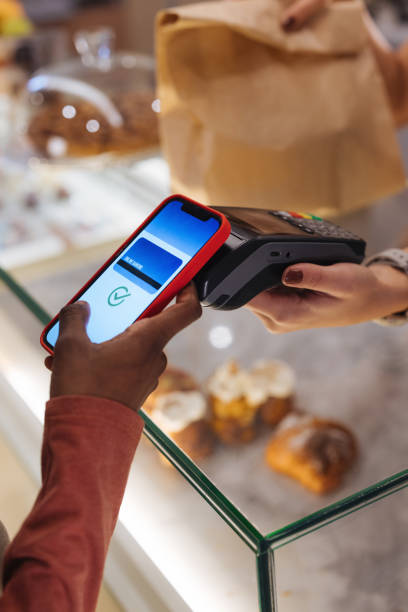 istock Contactless payment by a  phone 1946644549