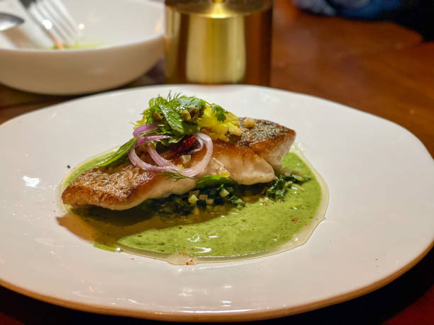 cod fish dish - comida-francesa fotografías e imágenes de stock