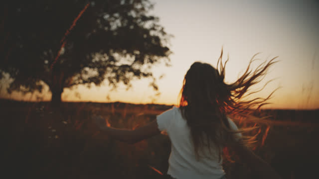 SLO MO Vintage Chasing Dreams: Young Girl's Sunset Escape into Nature