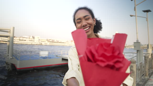 Young woman get a rose for valentine 's day.
