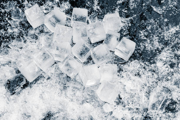 istock A heap of crushed ice cubes on a black background. 1946878346