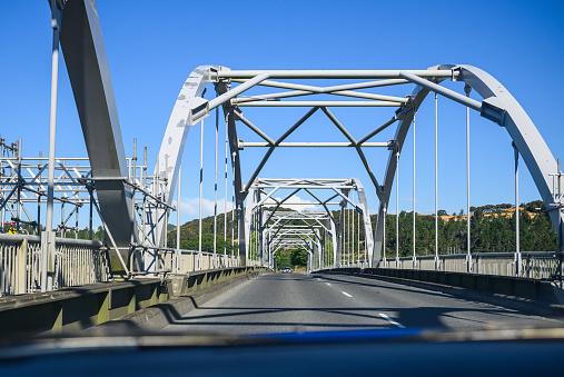 Driving through Tainui Bridge on the Waikato river. Huntly. New Zealand.