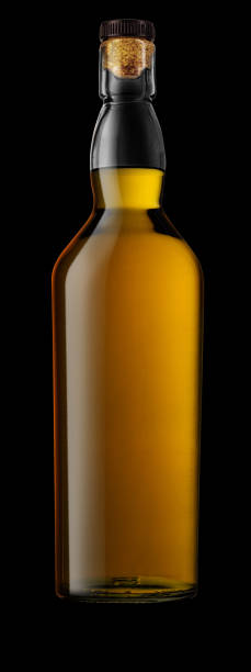istock Bottle of whisky, isolated on a black background. 1946896697