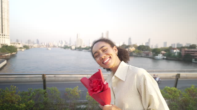 Young woman get a rose for valentine 's day.