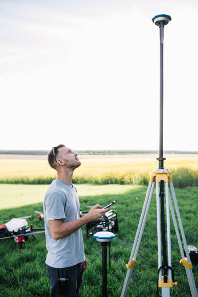 istock Farmer enters the GPS coordinates for the agricultural drone. 1946933526