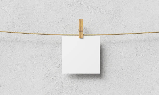 istock Blank Paper Hanging on Clothesline. Mock up. 3D Rendering 1946942641