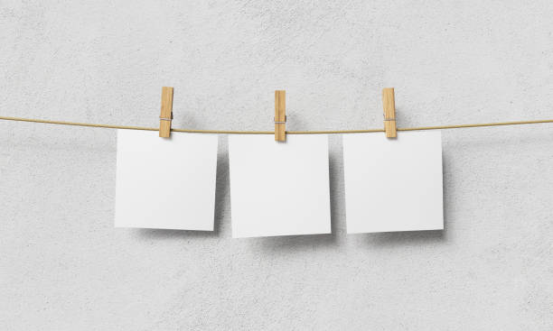 istock Blank Paper Hanging on Clothesline. Mock up. 3D Rendering 1946942987