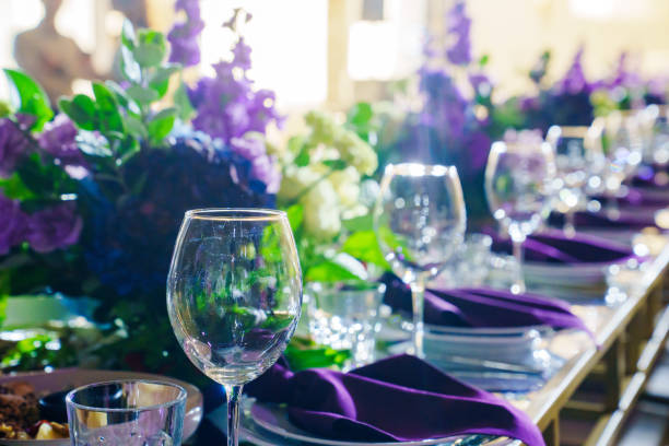 Table set with plates, cutlery, napkins, and glasses horizontal shot