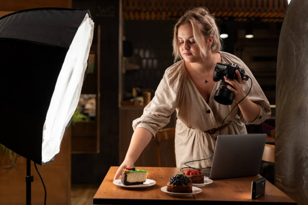 istock Young photographer photographing a menu for a modern cafe. Content creator creating photos for the menu 1946965098