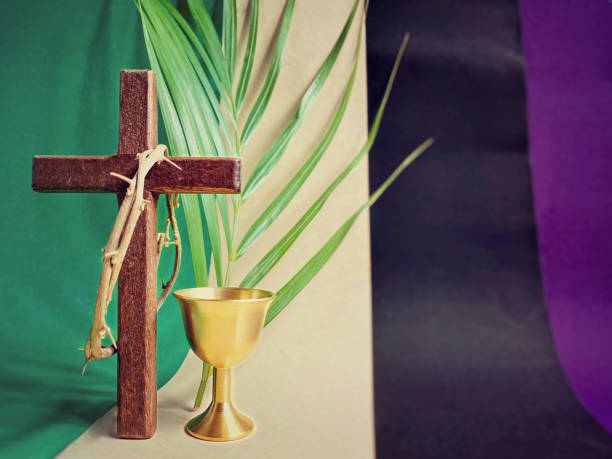Celebration - Lent Holy Week, Lent Season, Palm Sunday, Maundy Thursday, Good Friday, Easter Sunday Concept - front view of crown of thorns on wooden cross, chalice and palm leaf background. Stock photo. the passion of jesus stock pictures, royalty-free photos & images