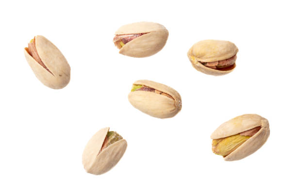 istock Fresh pistachios isolated on white background. Macro 1946984124