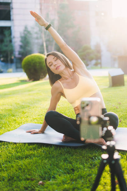 istock Slim woman doing yoga on mat 1947002169