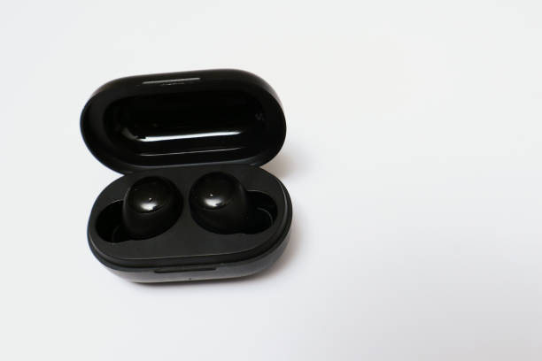 istock Wireless earbuds or earphones isolated on white background. Copy space and technology concept 1947008956