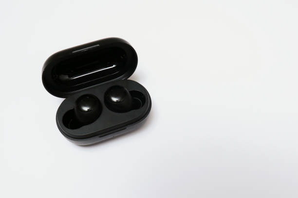 istock Wireless earbuds or earphones isolated on white background. Copy space and technology concept 1947008957