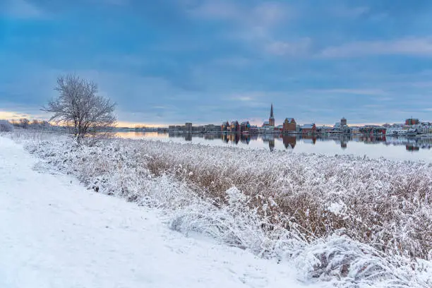 View over the Warnow in winter time to the Hanseatic city of Rostock, Germany.