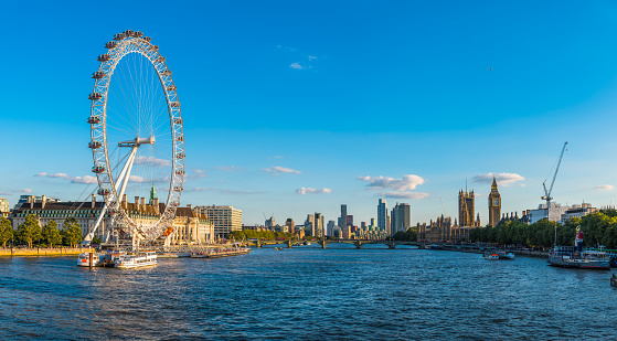 London Eye Great Britain. Beautiful autumn day with blue sky. Nice photo of bridges and architectures. Joyful and happy image.