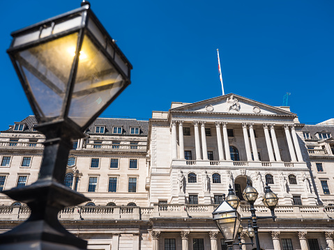 The Bank of England in the heart of the City of London Financial District overlooking the gas lamps of Threadneedle Street.