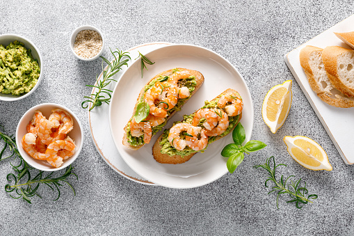 Shrimp and avocado sandwich with baguette and sesame. Top view