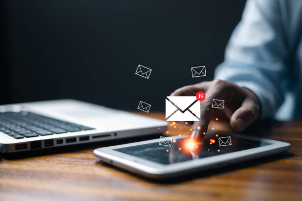 istock New email notification concept for business e-mail communication and digital marketing. Email marketing concept, person reading e-mail on digital tablet, receive new message. newsletter online. 1947228999