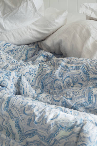 istock messy bed in early morning , messy bed after waking up 1947232270