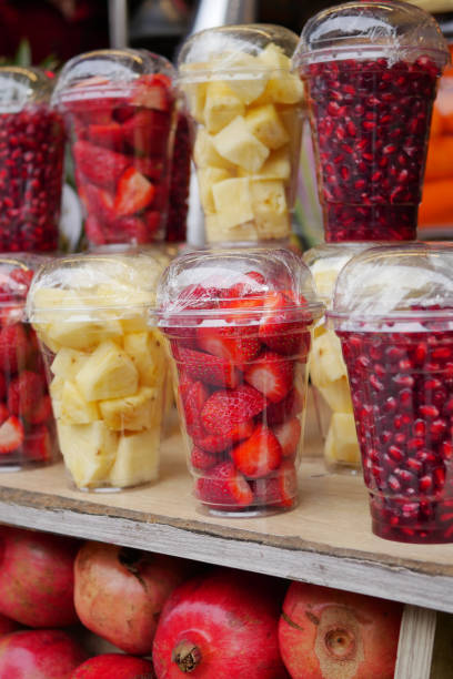 istock pineapple, kiwi and Strawberries in. plastic container selling at shop 1947237442