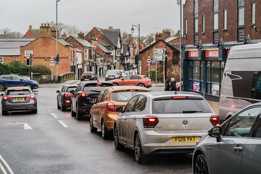 Nantwich, Cheshire, England, December 27th 2023. Traffic queue on a typical British town, with various cars waiting.