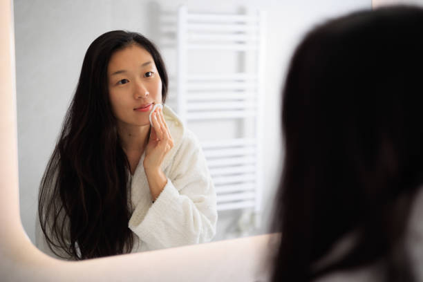 istock Women's beauty care routine- removing makeup 1947251449