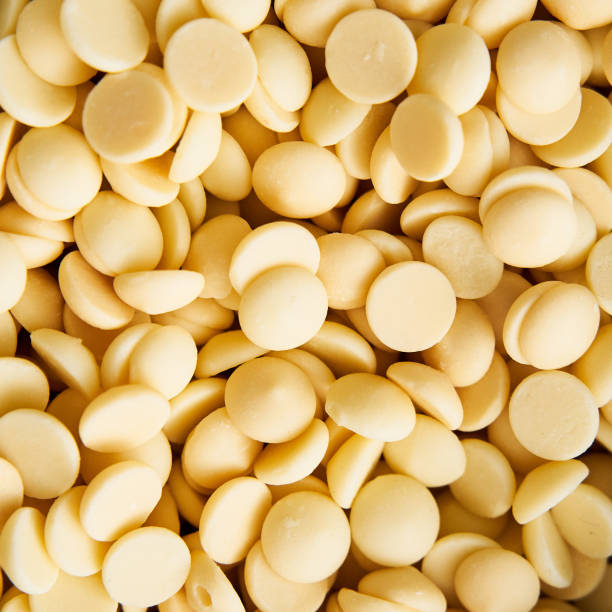 istock White chocolate drops in the bowl on white marble background. Baking ingredient 1947261283