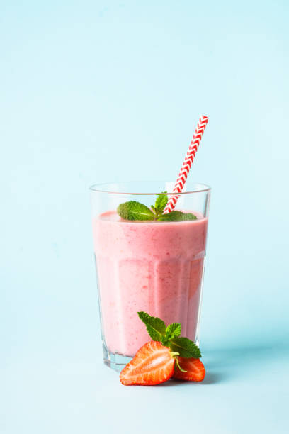 istock Strawberry smoothie or milkshake on white. 1947306475