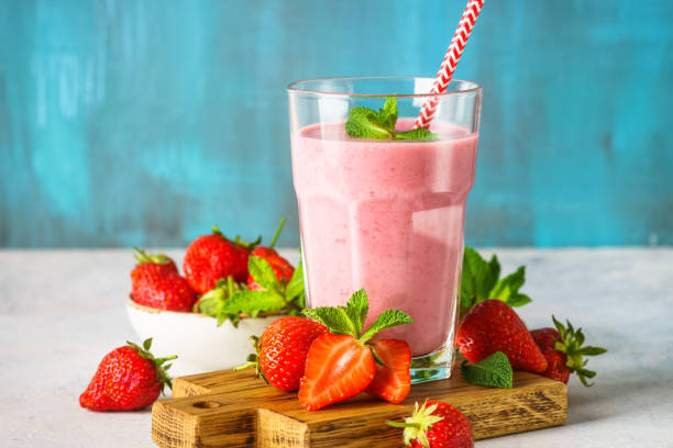 istock Strawberry smoothie or milkshake on white. 1947306495