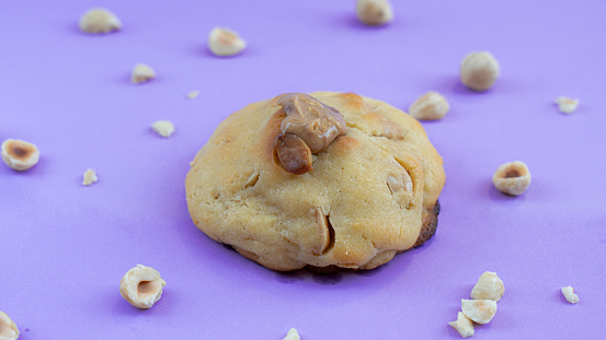 Table of homemade hazelnut chip cookies Stock Image on purple background