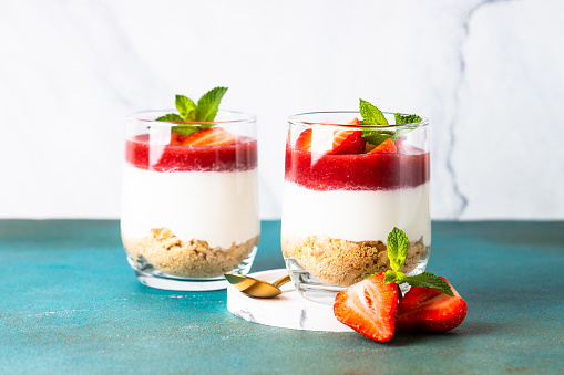 Cheesecake in a glass. Strawberry cheesecake, delicious dessert no baking with fresh berries.