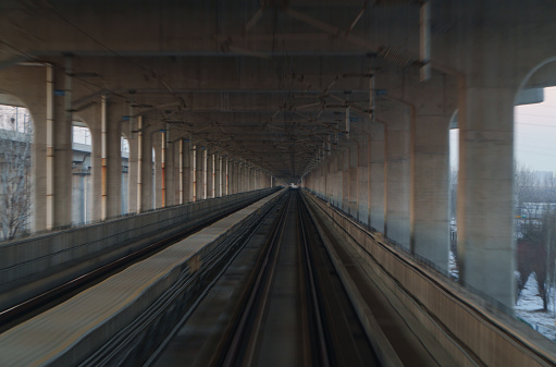 High-speed train is traveling under the bridge