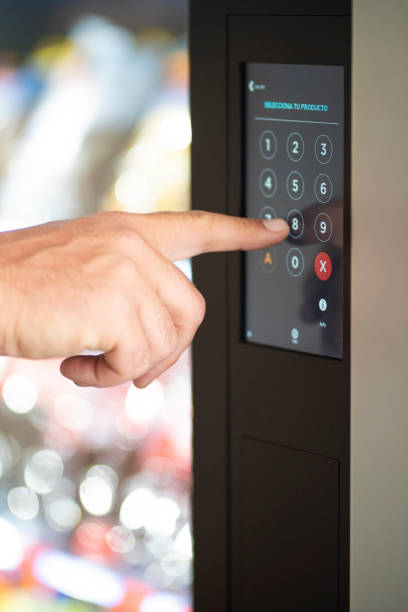 istock Close up of man hand typing number code on touch screen display - concept of security password and automatic distributor food - caucasian male finger type 8 1947317417