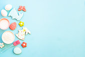 Easter baking background at blue flat lay.