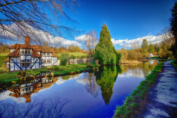 September 30th. 2024. The River Avon in the historic market town of Tewksbury, Gloucestershire. England, UK.  This is the old town built around the river. Boats moored alongside the river next to the old houses.