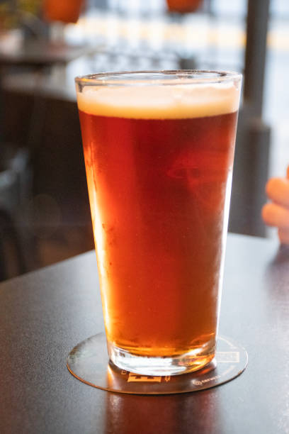 istock refreshing glass of craft ale ipa beer on pub table 1947332149